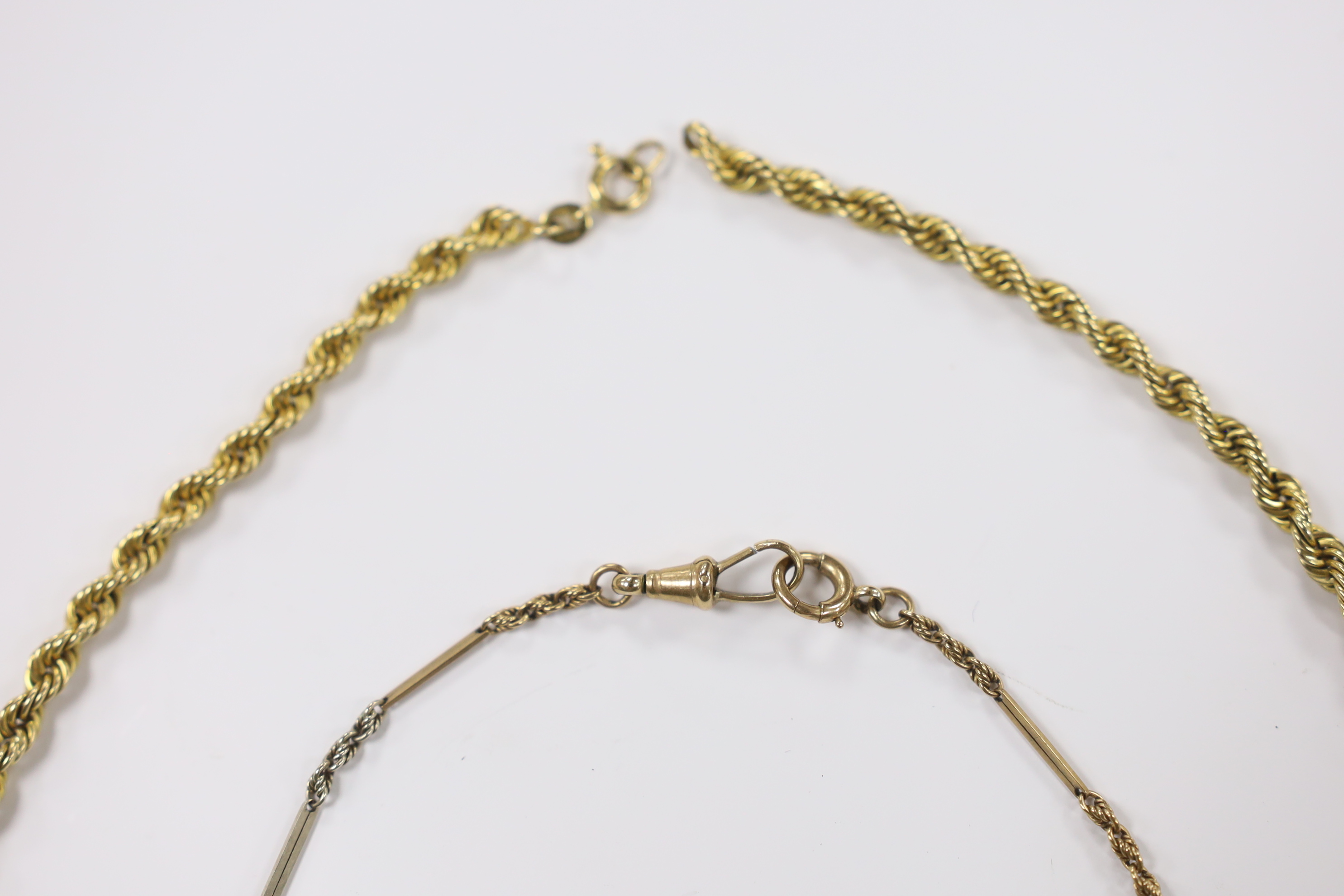 A yellow metal overlaid fob seal on a damaged 9ct gold bracelet, together with a yellow metal masonic ball on a yellow metal chain.